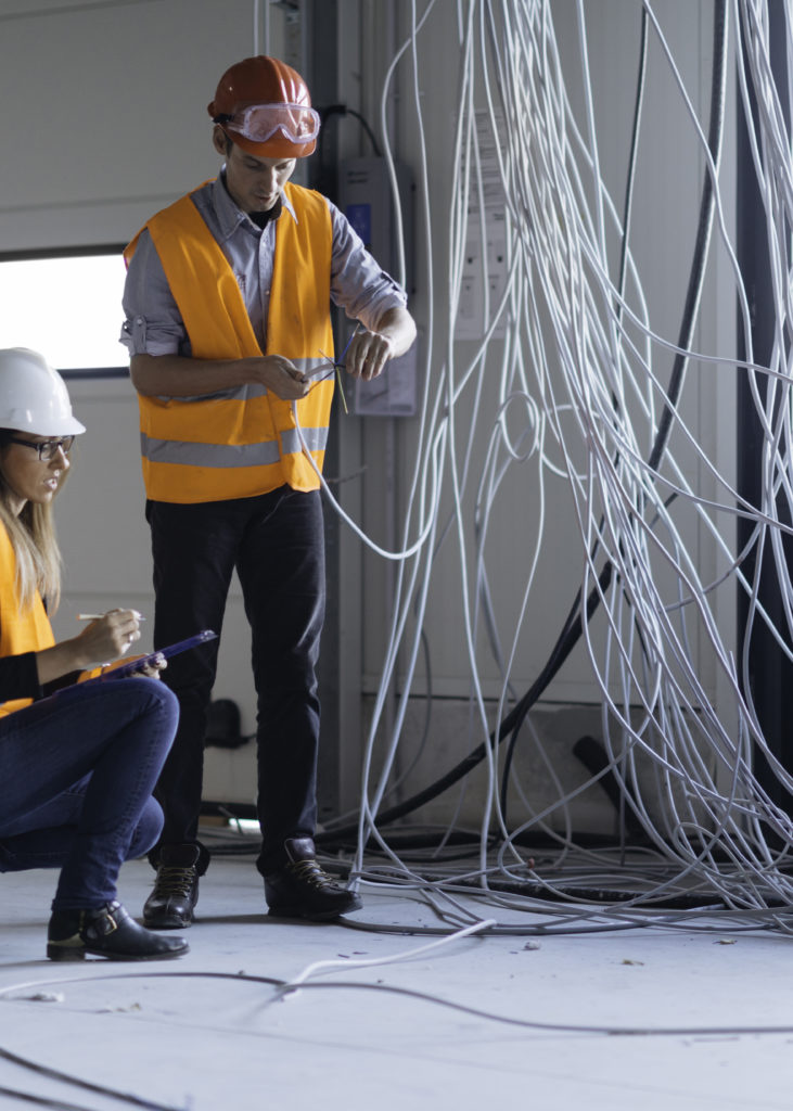Quality inspectors checking construction progress